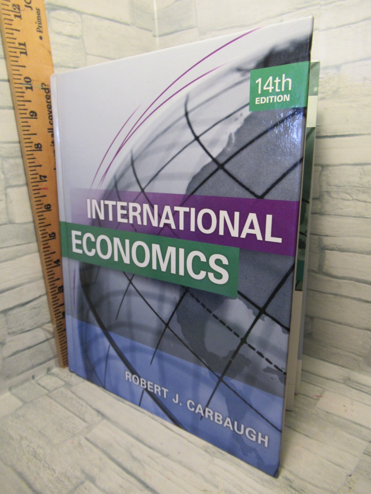 International Economics/ 14th edition/ by Robert J. Carbaugh / Like new /